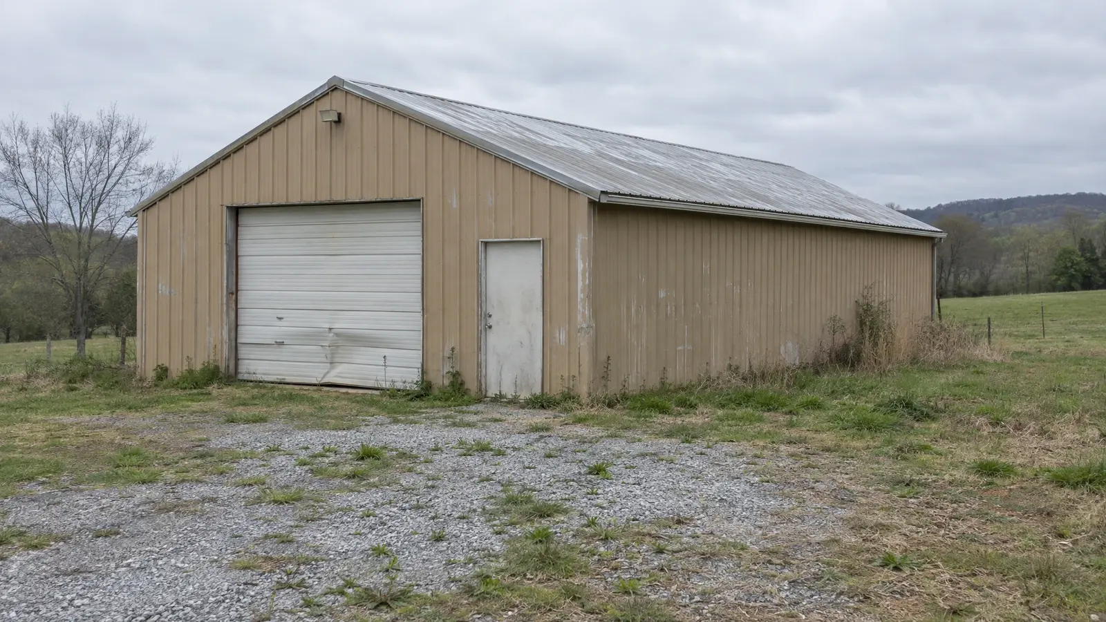 Before: a dated metal barn with faded roof and dull siding
